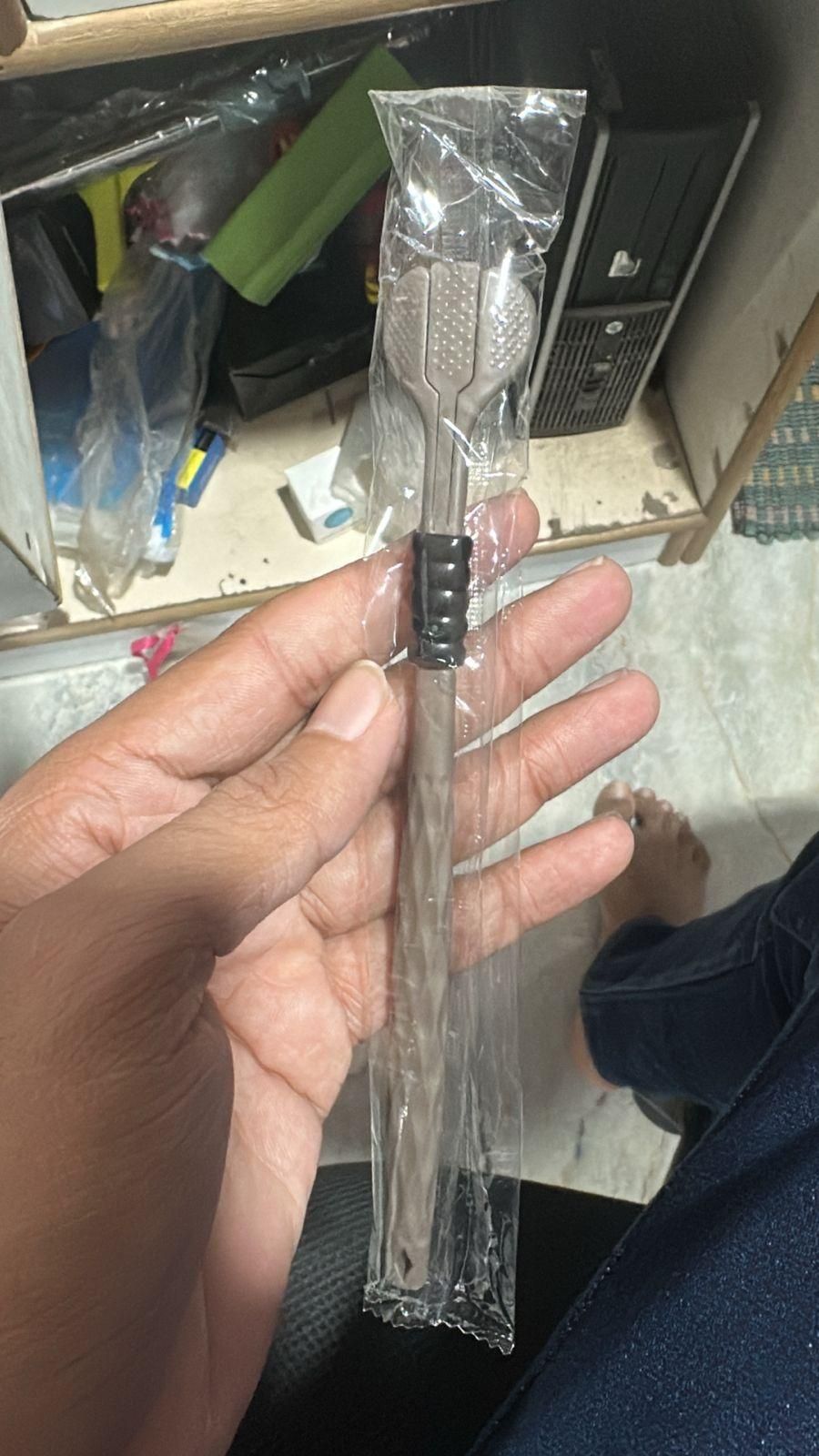Best toothbrush for braces and sensitive gums with soft bristles held in hand wrapped in clear plastic