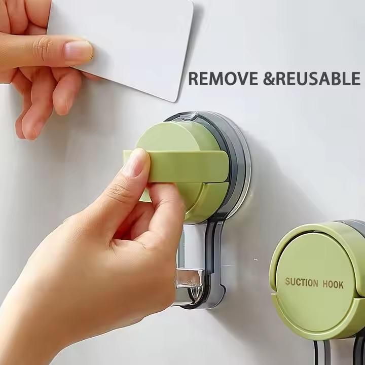 Suction wall hooks pack of 2 with green handles easily removable and reusable on a smooth surface