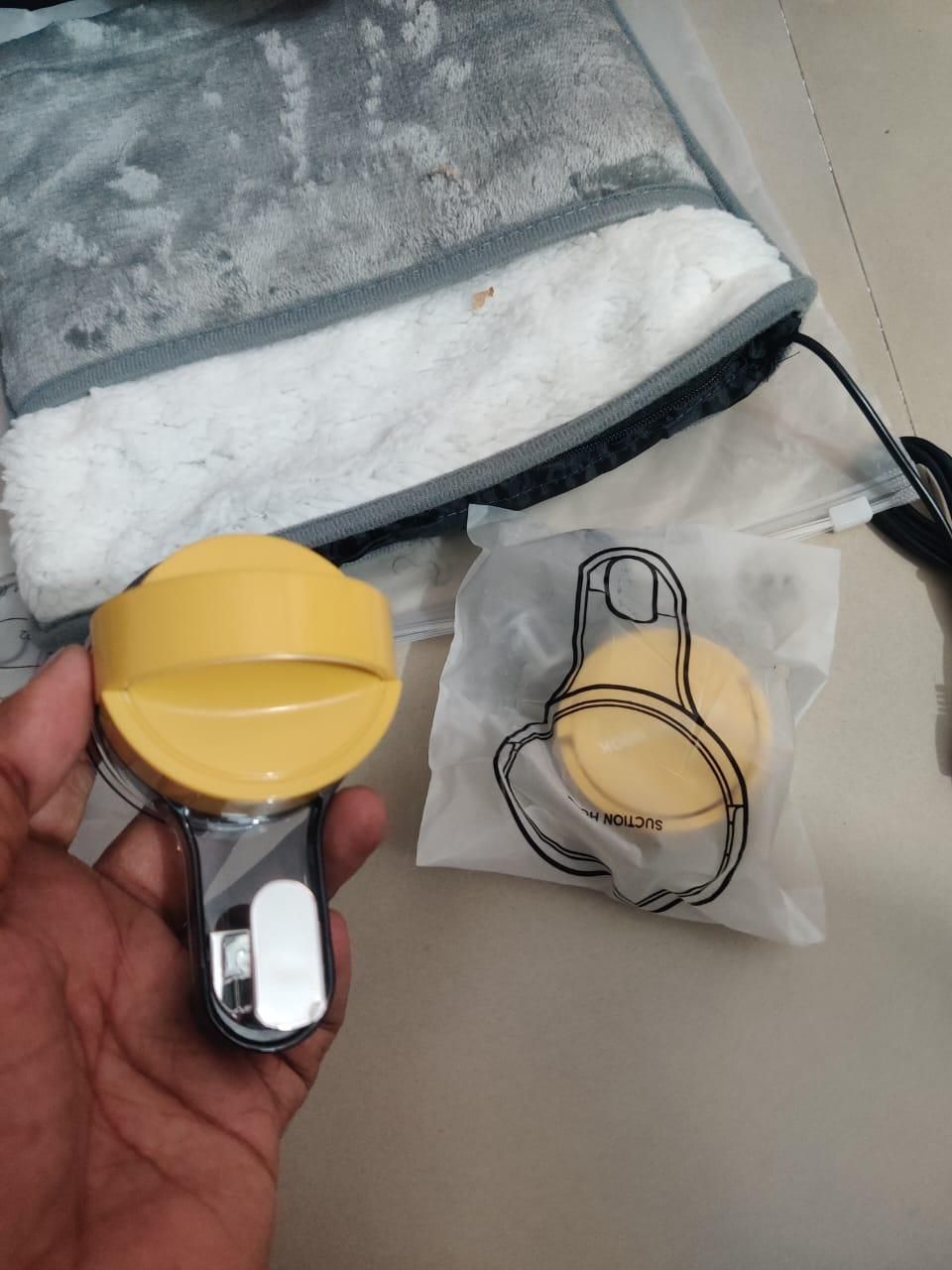 Suction wall hooks pack of 2 with yellow tops and black handles held in hand and in packaging